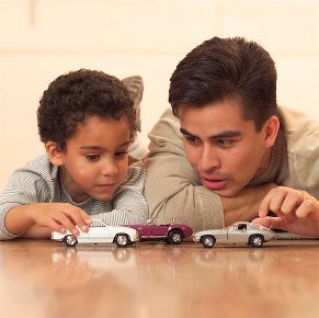 father and son playing cars