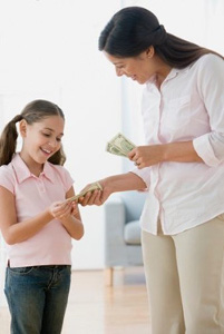 mother giving daughter allowance