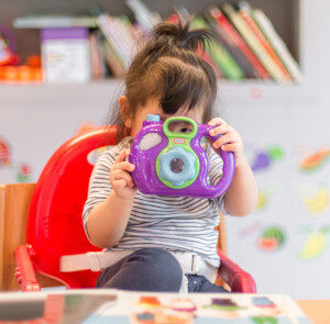 child with camera